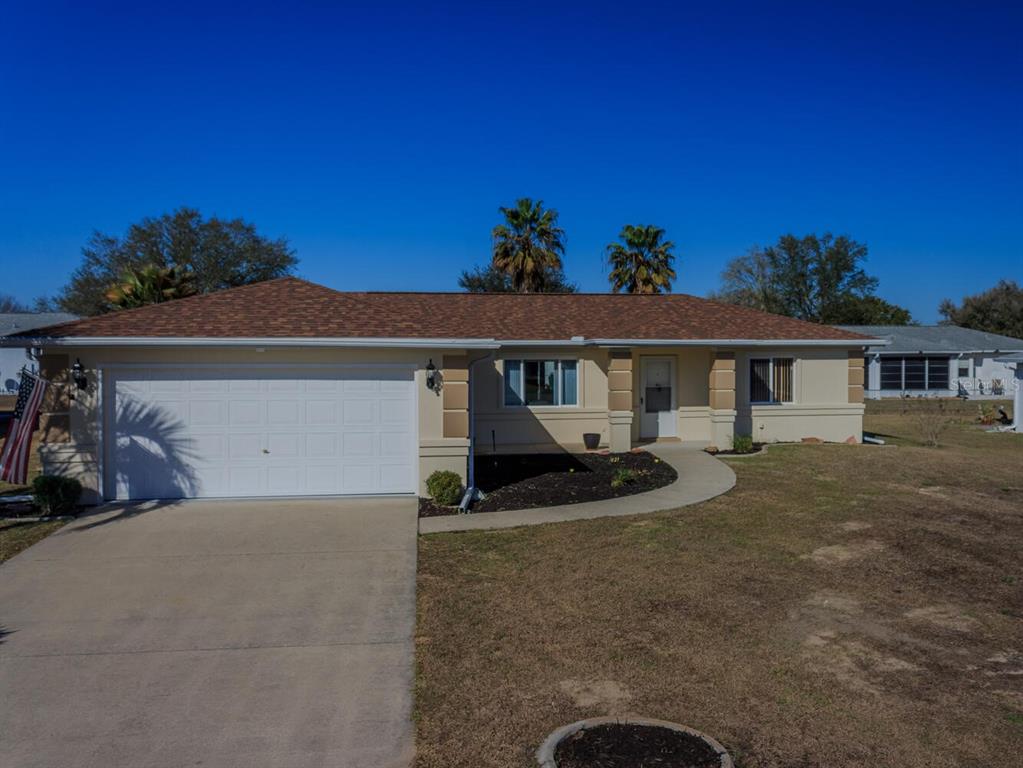 6086 Southwest 98th Loop Ocala, FL 34476 - Photo 26 of 49 a front view of a house with sitting space