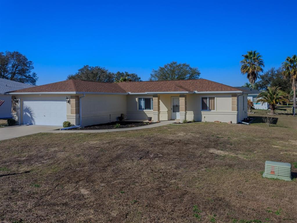 6086 Southwest 98th Loop Ocala, FL 34476 - Photo 27 of 49 a view of a house with a yard