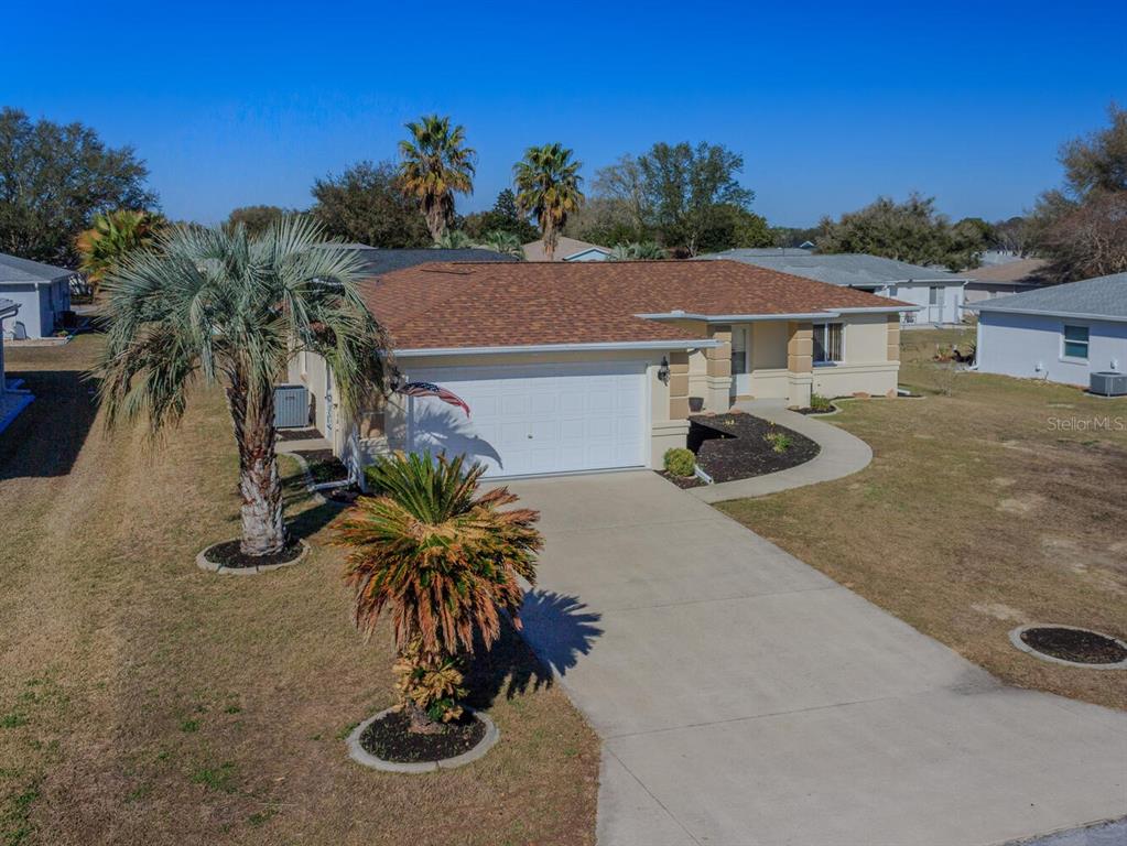 6086 Southwest 98th Loop Ocala, FL 34476 - Photo 30 of 49 a view of a house with pool and yard