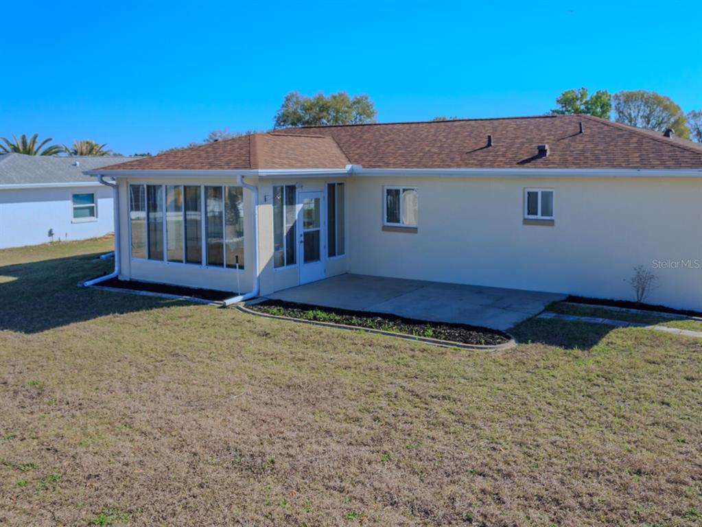 6086 Southwest 98th Loop Ocala, FL 34476 - Photo 32 of 49 front view of a house with a fence
