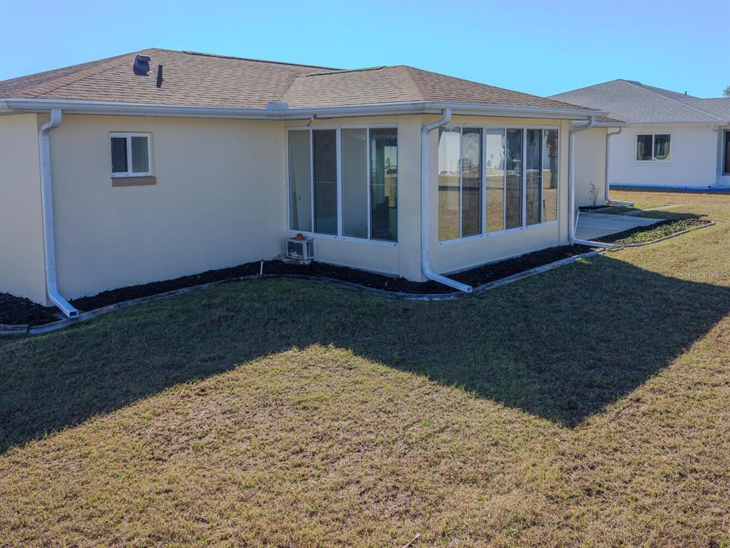 6086 Southwest 98th Loop Ocala, FL 34476 - Photo 33 of 49 a view of a house with a yard