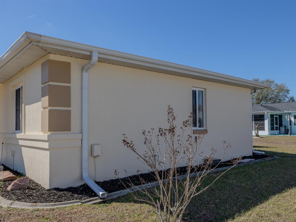 6086 Southwest 98th Loop Ocala, FL 34476 - Photo 34 of 49 a front view of a house with garden