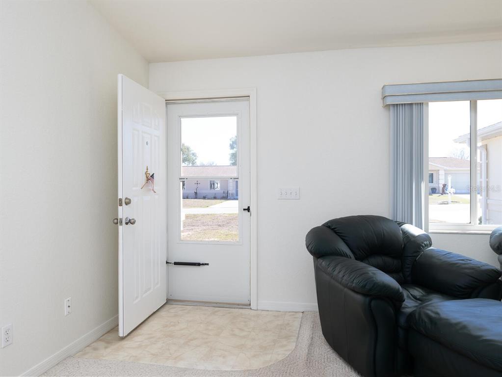 6086 Southwest 98th Loop Ocala, FL 34476 - Photo 4 of 49 a living room with furniture and a window