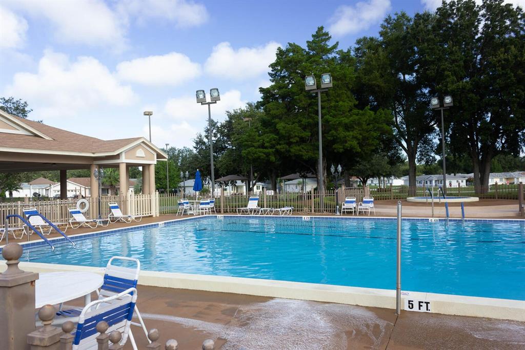 6086 Southwest 98th Loop Ocala, FL 34476 - Photo 41 of 49 a view of a swimming pool with a patio