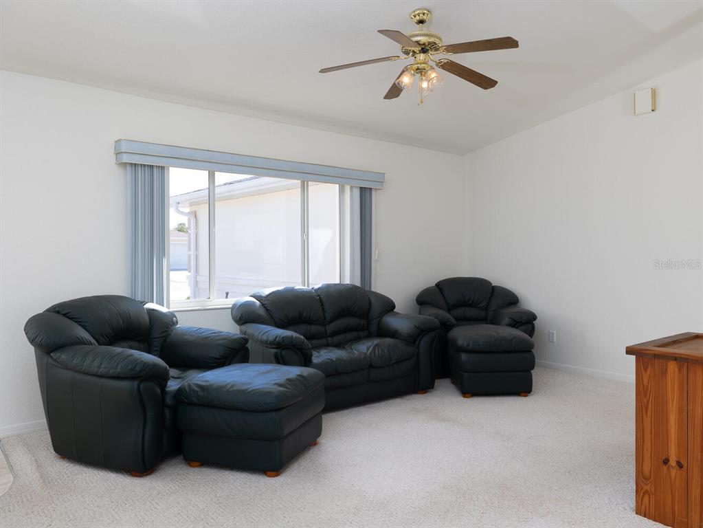 6086 Southwest 98th Loop Ocala, FL 34476 - Photo 5 of 49 a living room with furniture and a window