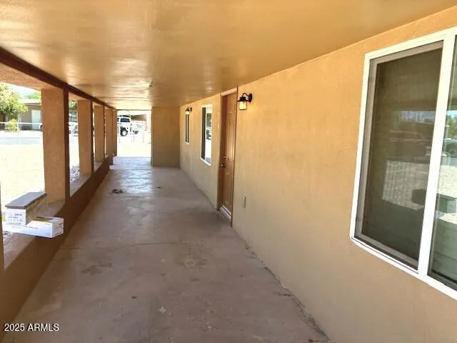 a view of hallway with furniture