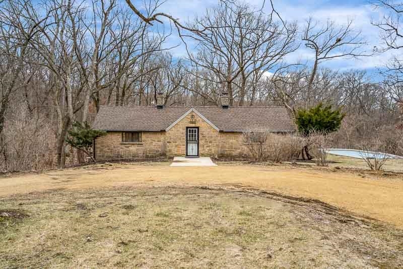 3134 North River Road Oregon, IL 61061 - Photo 1 of 59 a front view of a house with a yard and garage