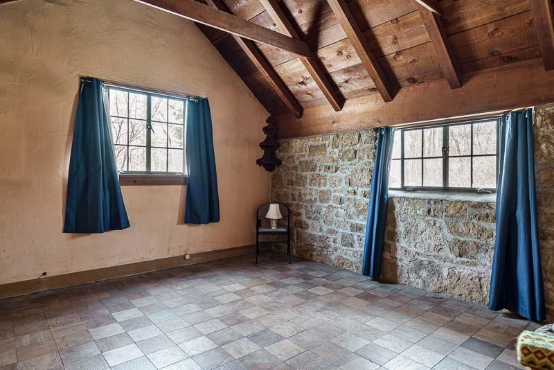 3134 North River Road Oregon, IL 61061 - Photo 13 of 59 a view of empty room with wooden floor and fan