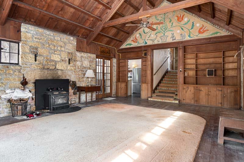 3134 North River Road Oregon, IL 61061 - Photo 22 of 59 a view of an empty room with fireplace and a window