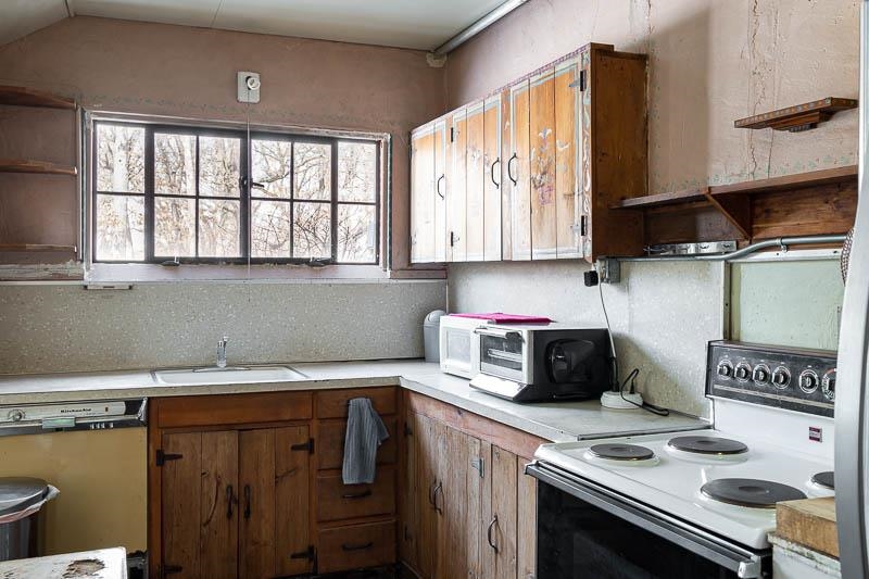 3134 North River Road Oregon, IL 61061 - Photo 27 of 59 a kitchen with a sink cabinets and a window
