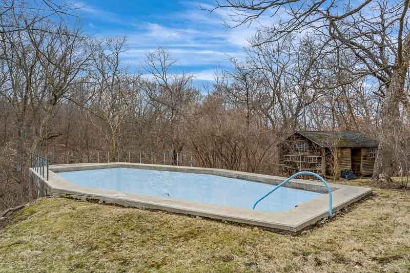 3134 North River Road Oregon, IL 61061 - Photo 41 of 59 a view of a pool with a yard