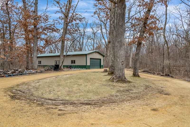 3134 North River Road Oregon, IL 61061 - Photo 5 of 59 a front view of house with yard and trees