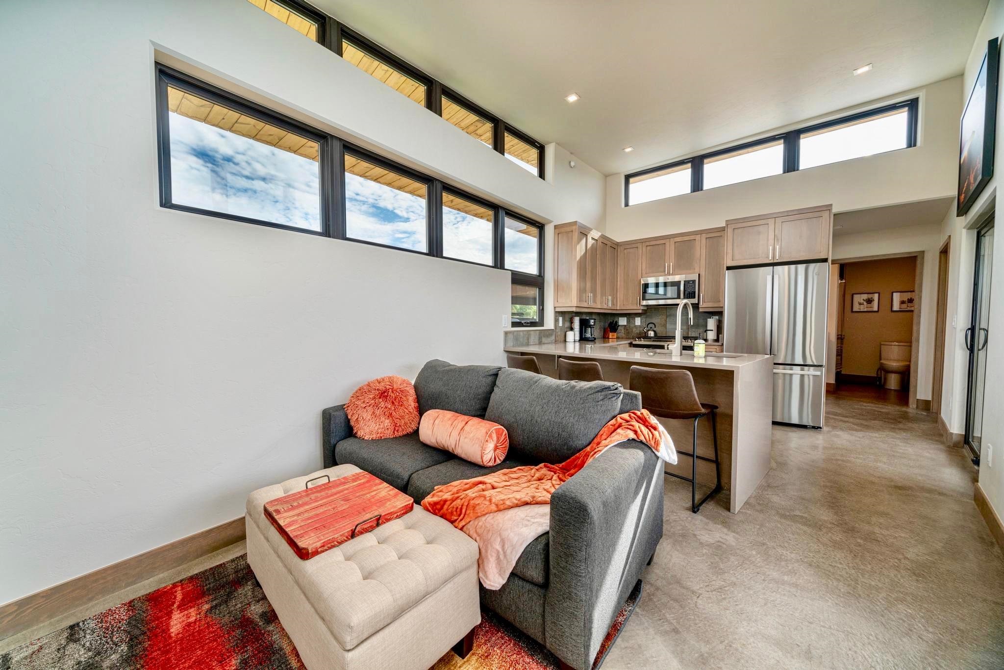 450 Red River Loop Clifton, CO 81520 - Photo 2 of 18 a living room with stainless steel appliances furniture a rug and a kitchen view
