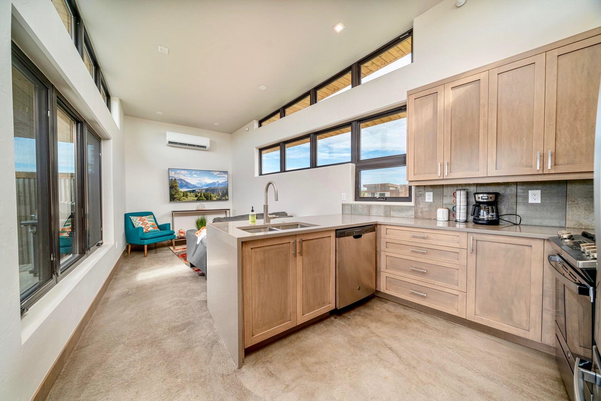 450 Red River Loop Clifton, CO 81520 - Photo 5 of 18 a kitchen with stainless steel appliances granite countertop a stove and cabinets