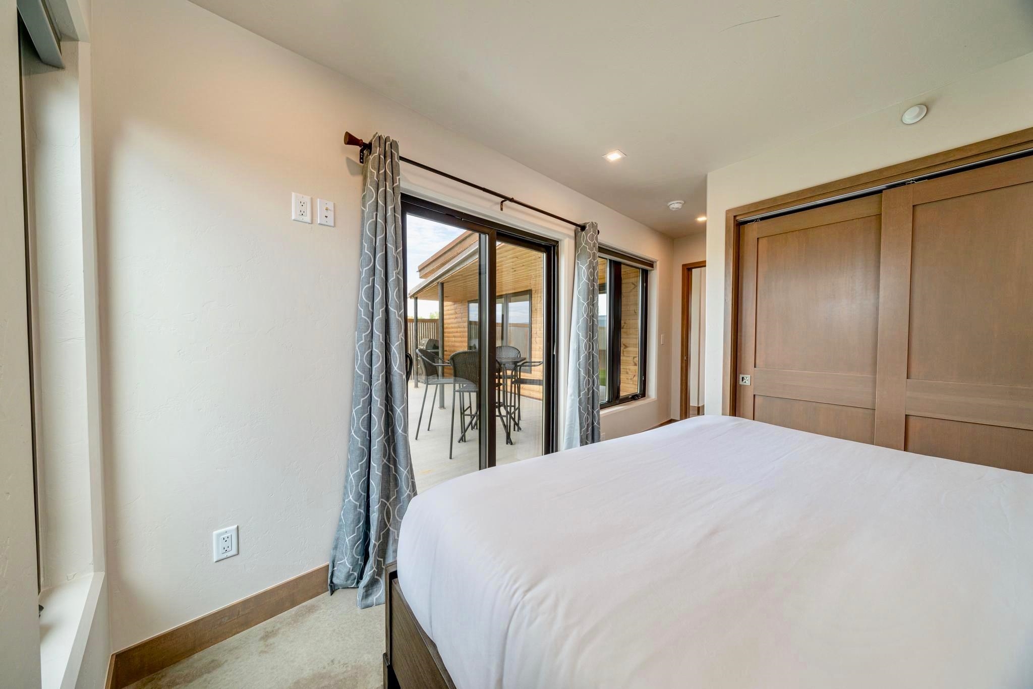 450 Red River Loop Clifton, CO 81520 - Photo 8 of 18 a large bed sitting in a bedroom next to a window