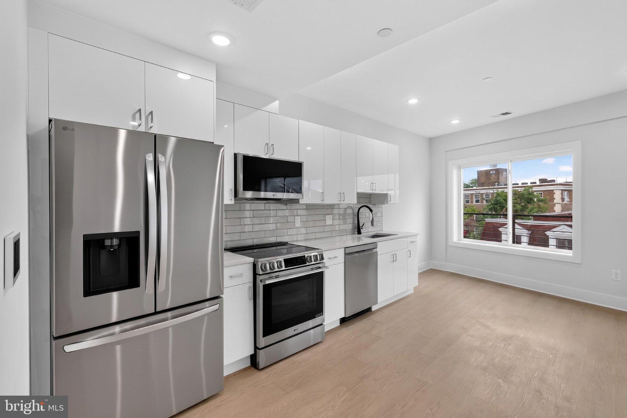 1650 Columbia Road Northwest, Unit 401 Washington, DC 20009 - Photo 4 of 21 Modern kitchen with sleek finishes.