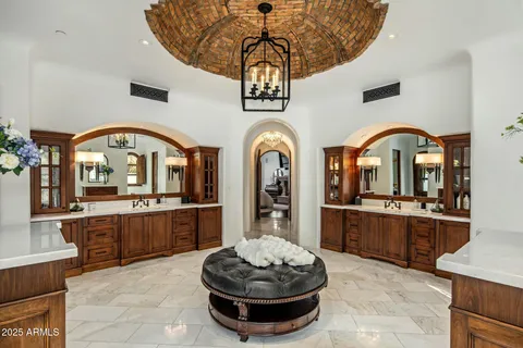 a living room with stainless steel appliances granite countertop lots of wooden furniture