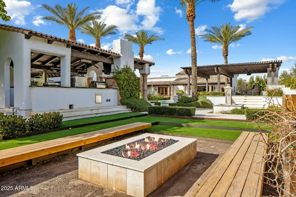 a front view of a house with swimming pool yard and outdoor seating