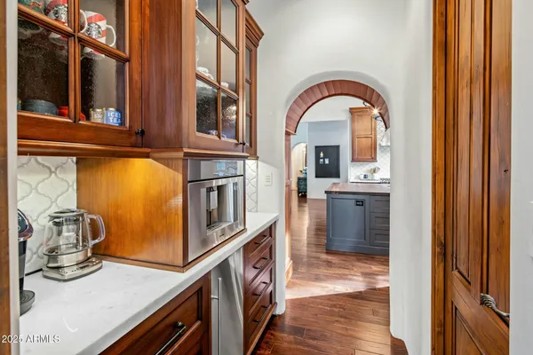a kitchen with stainless steel appliances granite countertop a sink and cabinets