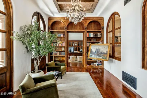 a view of living room with patio furniture and wooden floor
