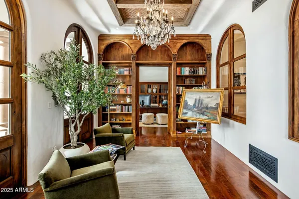 a view of living room with patio furniture and wooden floor