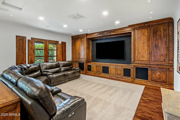 a bathroom with a granite countertop sink a mirror and a shower