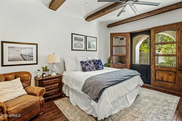 a living room with a sink and chandelier