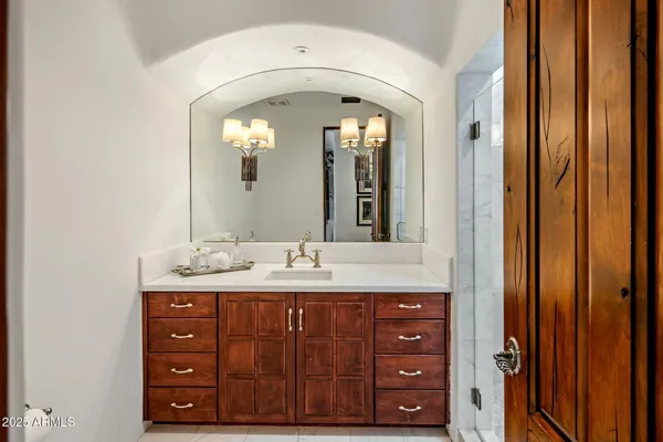 a large kitchen with stainless steel appliances granite countertop a stove and a sink