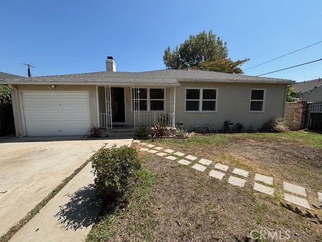 7252 Rhea Avenue Reseda, CA 91335 - Photo 2 of 6 a front view of a house with a yard