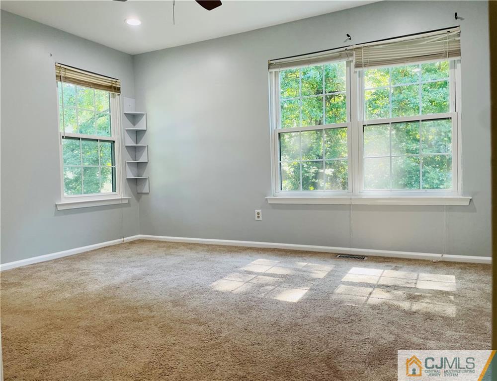 701 Timber Oaks Road Edison, NJ 08820 - Photo 17 of 23 an empty room with windows