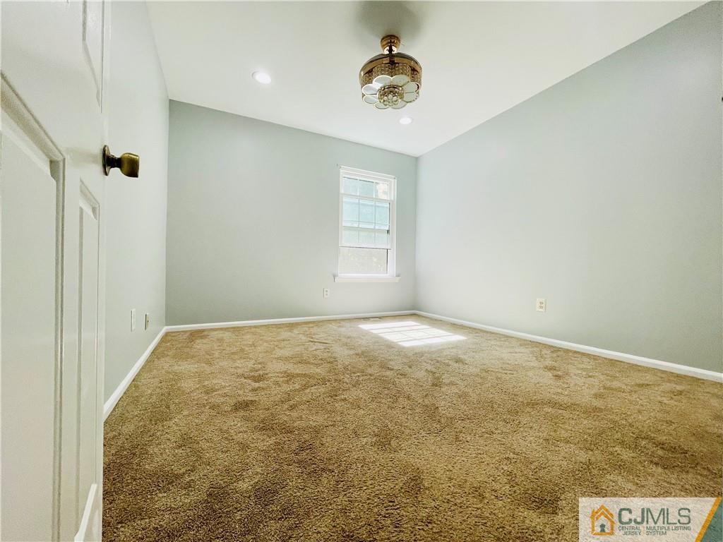 701 Timber Oaks Road Edison, NJ 08820 - Photo 20 of 23 an empty room with a window