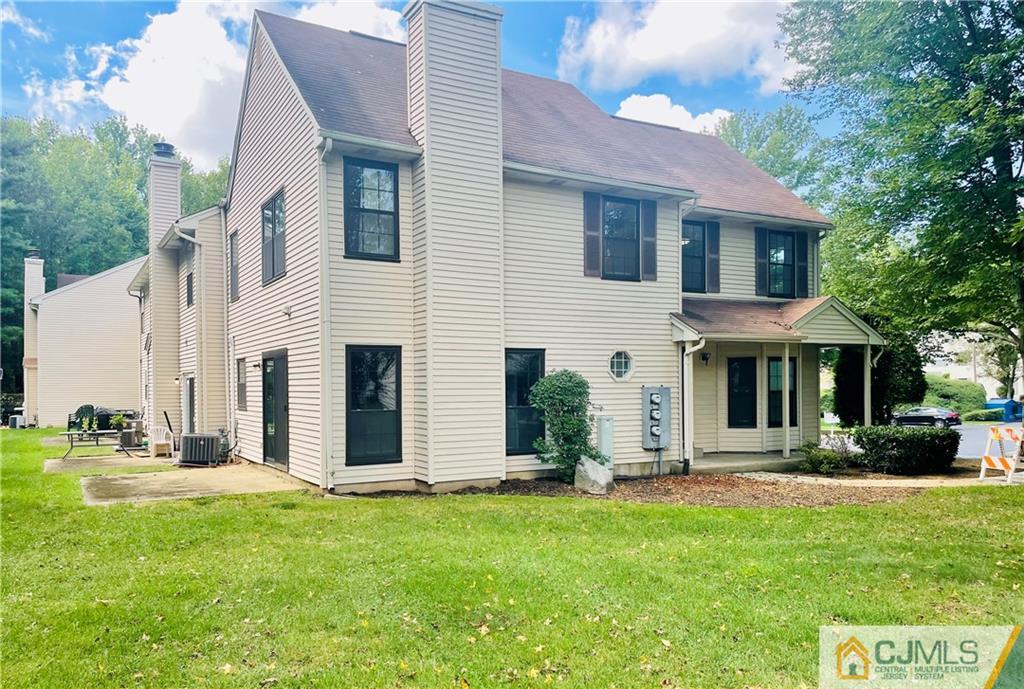 701 Timber Oaks Road Edison, NJ 08820 - Photo 2 of 23 a front view of a house with a yard