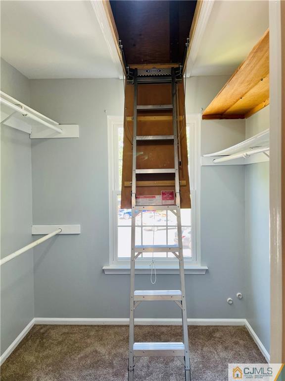 701 Timber Oaks Road Edison, NJ 08820 - Photo 21 of 23 a view of walk in closet with empty racks
