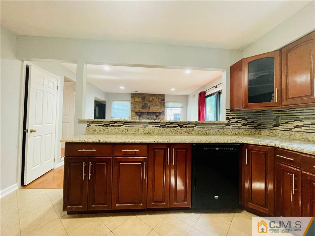 701 Timber Oaks Road Edison, NJ 08820 - Photo 5 of 23 a kitchen with stainless steel appliances granite countertop a sink and cabinets