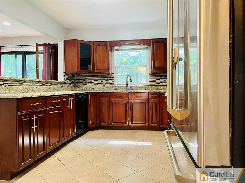 701 Timber Oaks Road Edison, NJ 08820 - Photo 6 of 23 a bathroom with a granite countertop sink and a mirror