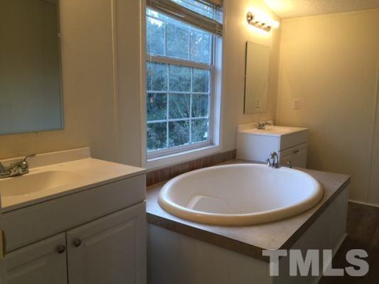 10835 Smith Road Middlesex, NC 27557 - Photo 9 of 13 a bathroom with a sink and a toilet