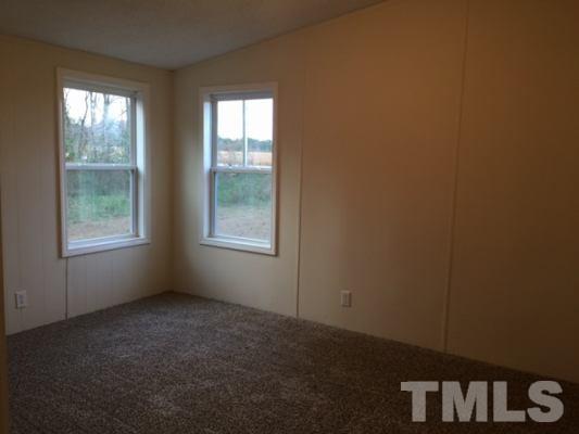 10835 Smith Road Middlesex, NC 27557 - Photo 10 of 13 an empty room with windows