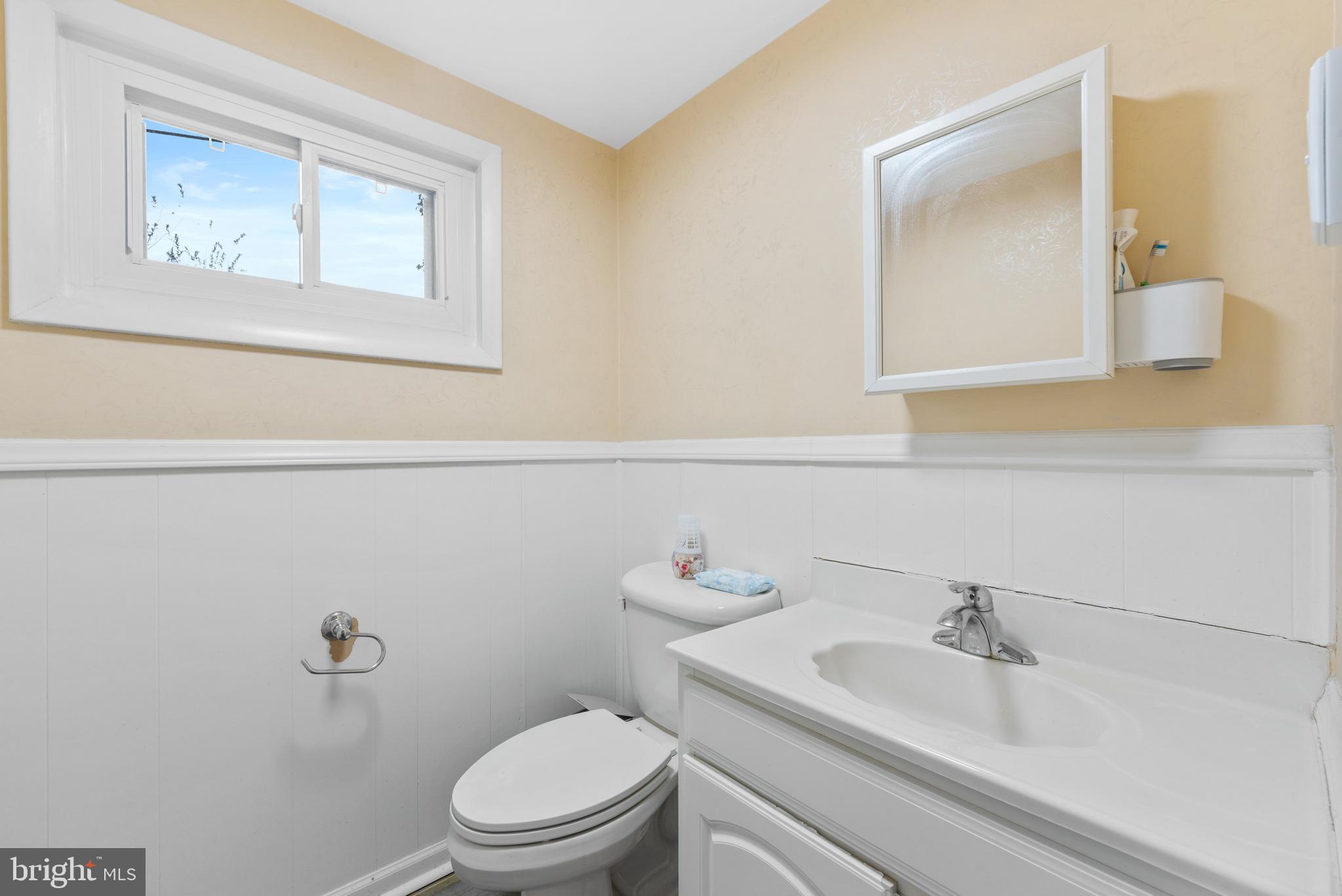 416 Emerson Road Huntingdon Valley, PA 19006 - Photo 30 of 36 a bathroom with a sink mirror and toilet