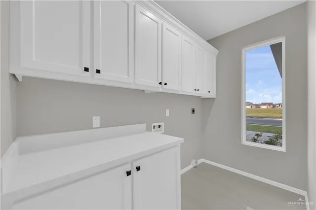 a bathroom with a sink and cabinets