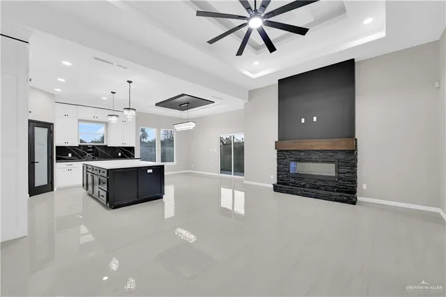 a kitchen with stainless steel appliances a refrigerator sink and cabinets