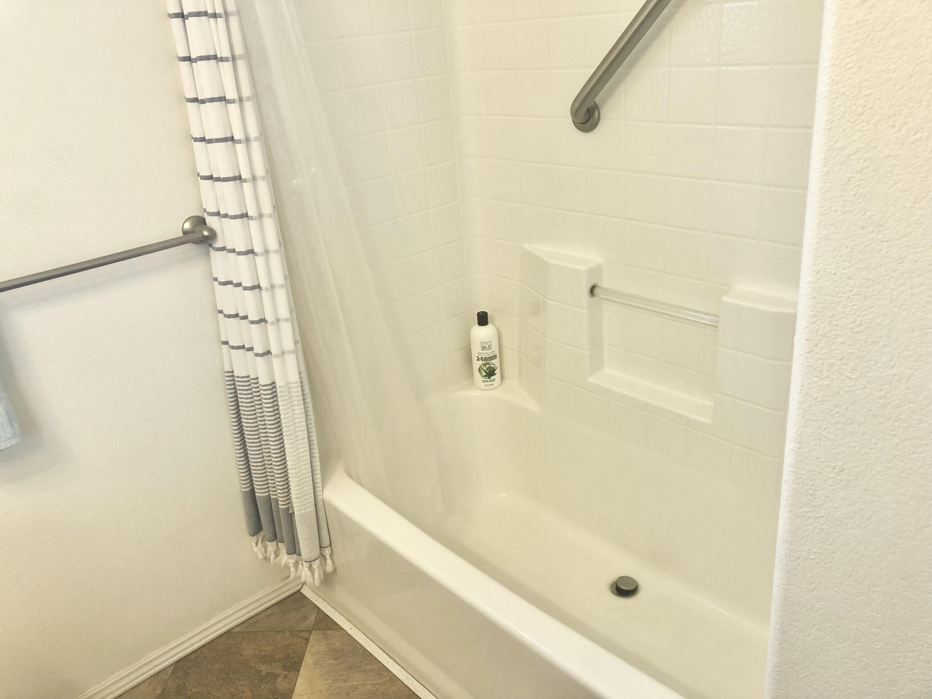 74711 Dillon Road Desert Hot Springs, CA 92241 - Photo 12 of 44 a bathroom with a shower