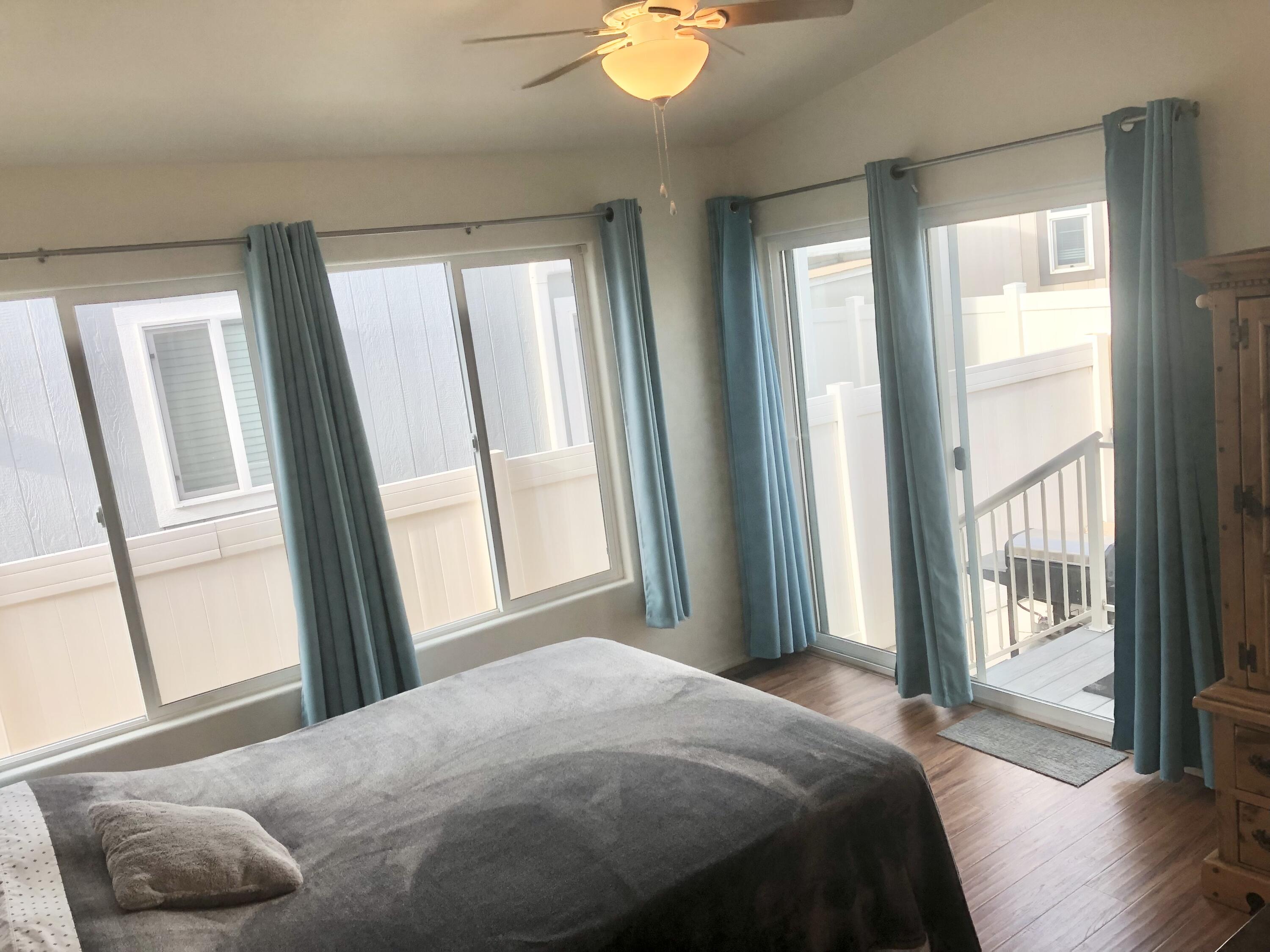 74711 Dillon Road Desert Hot Springs, CA 92241 - Photo 14 of 44 a bedroom with a bed and a window