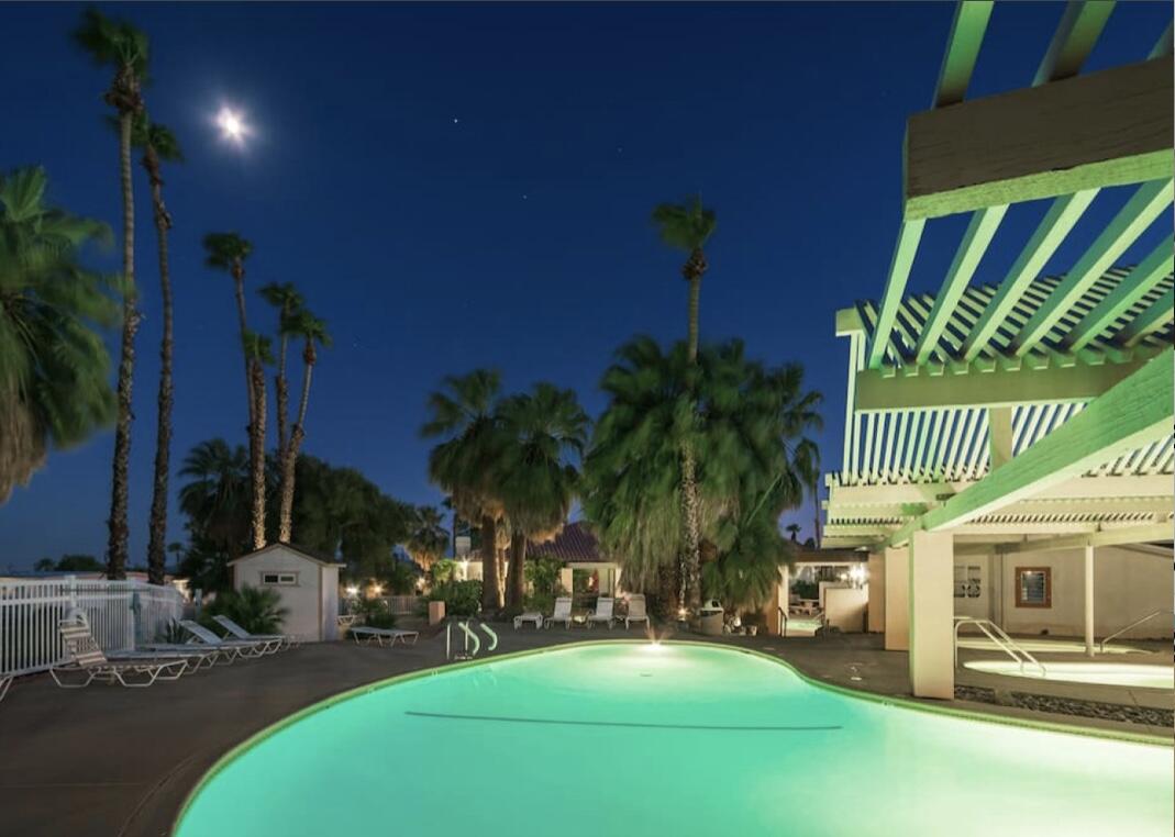 74711 Dillon Road Desert Hot Springs, CA 92241 - Photo 19 of 44 a row of palm trees and a patio