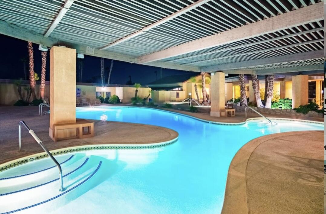 74711 Dillon Road Desert Hot Springs, CA 92241 - Photo 20 of 44 an outdoor sitting area with a table and chairs