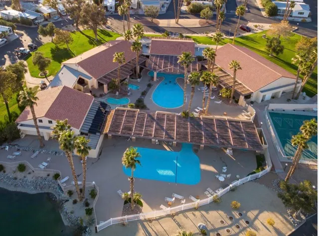 a view of a swimming pool with a table and chairs