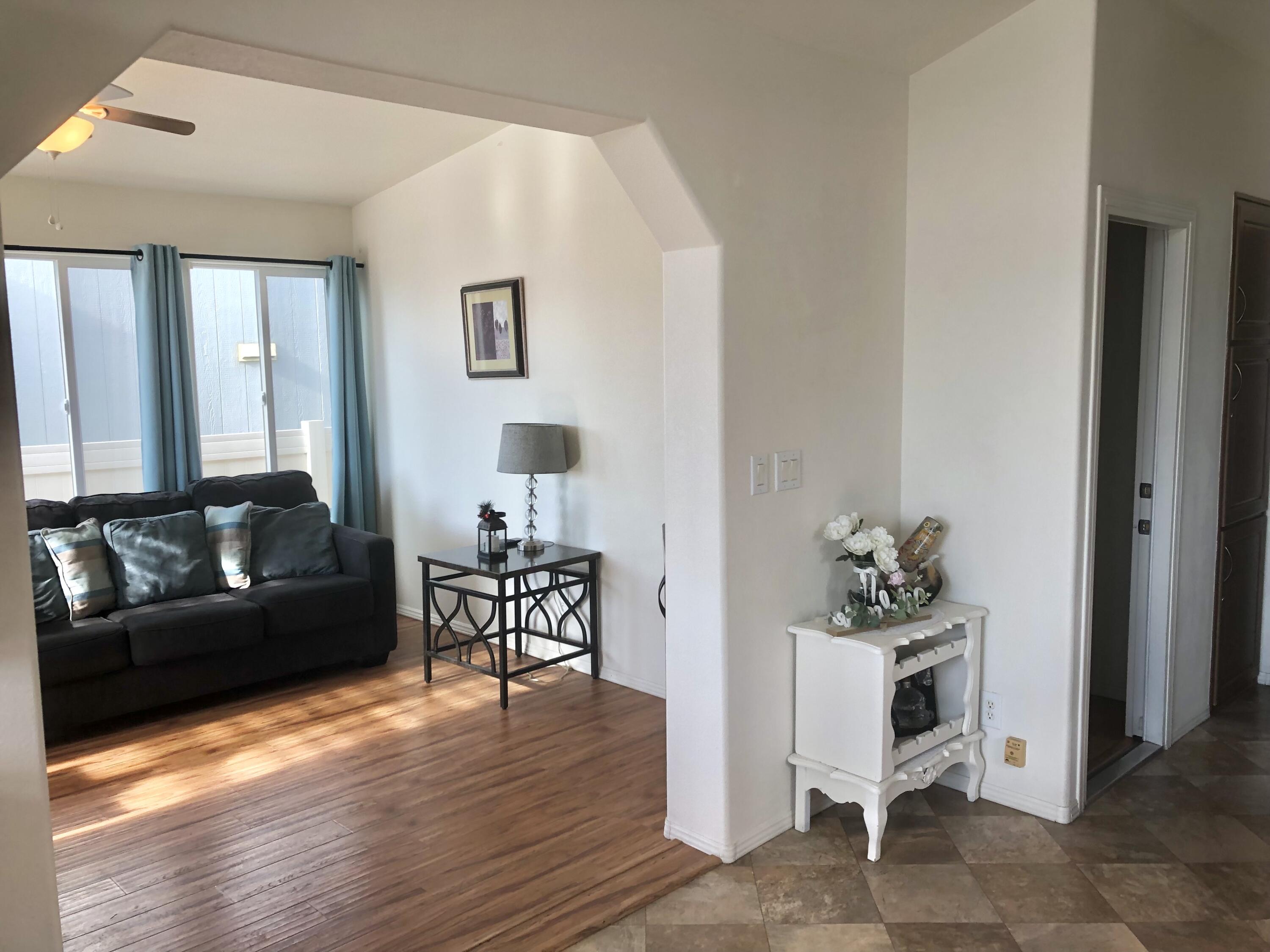 74711 Dillon Road Desert Hot Springs, CA 92241 - Photo 6 of 44 a living room with furniture and wooden floor
