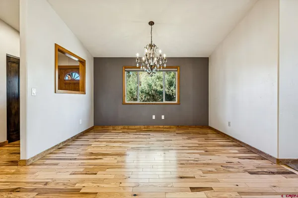 a spacious bedroom with a bed and a couch