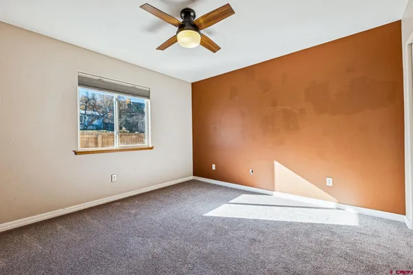 a view of empty room with windows