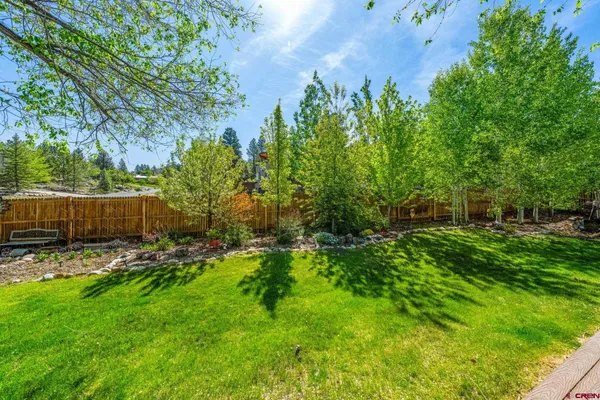 a backyard of a house with lots of green space