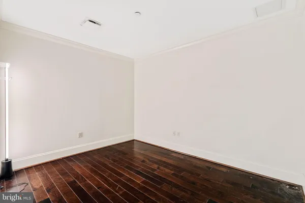 a view of room with wooden floor